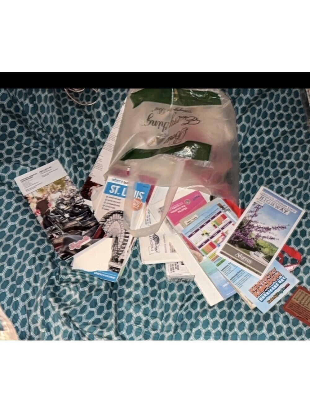Bag of travel brochures and pamphlets, seemingly gathered from various locations